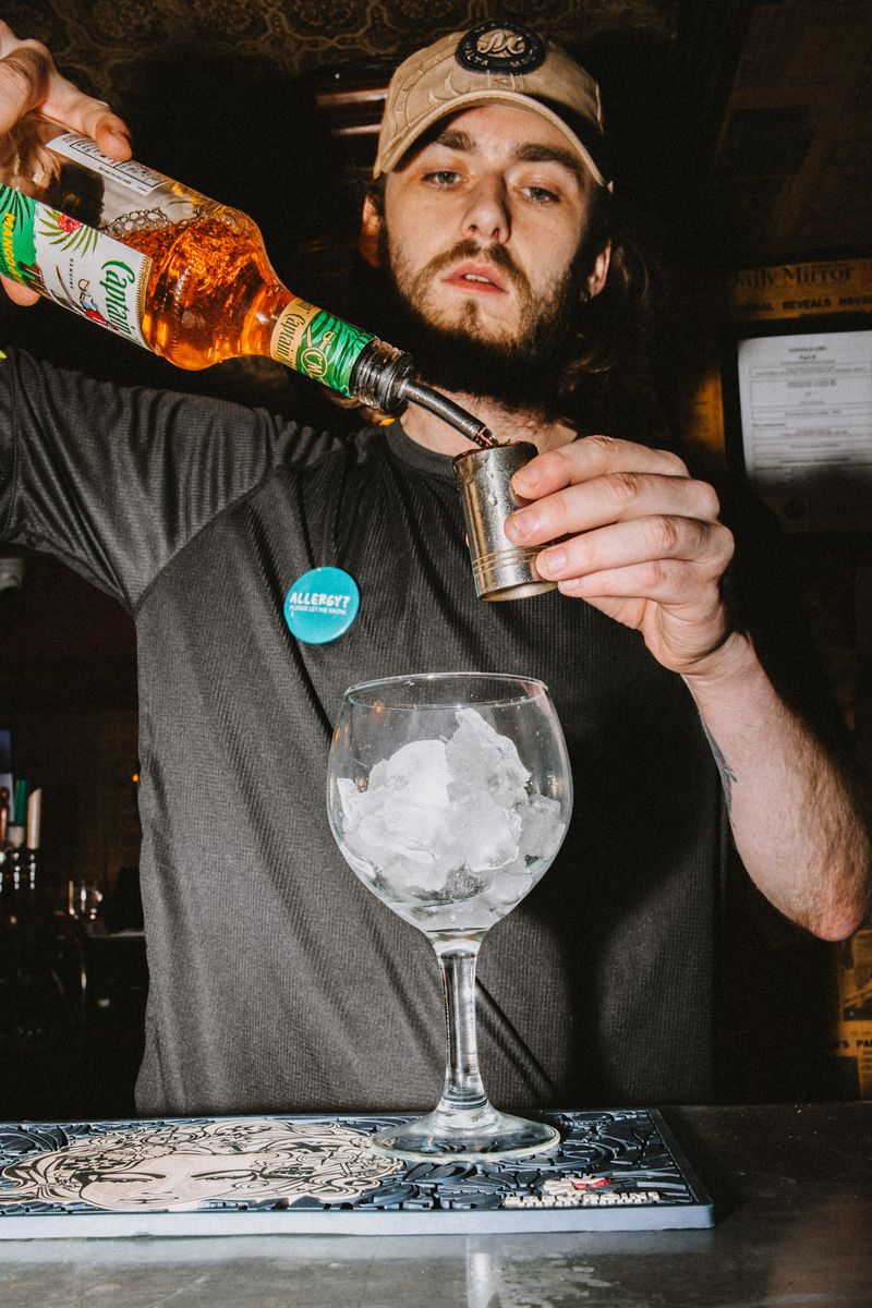 Bar staff making a cocktail