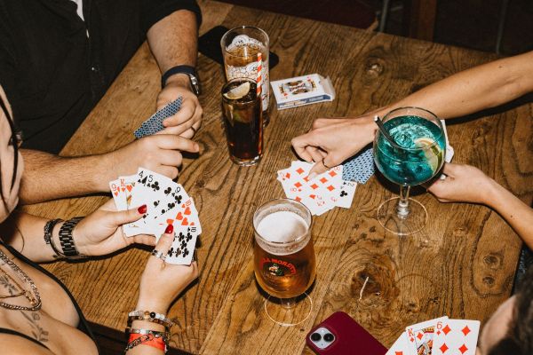 Celebrating a win by cheersing pints