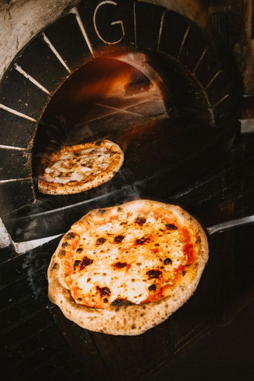 Two pizzas in the pizza oven at The Playwright Nottingham