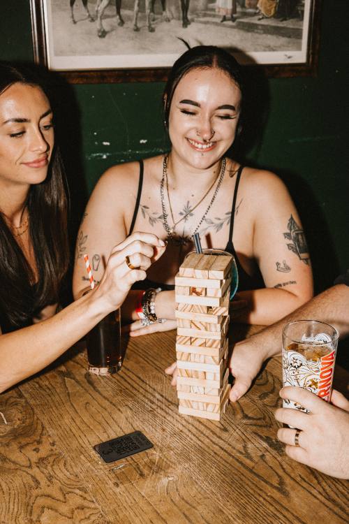 Friends meeting up to play boardgames at the pub